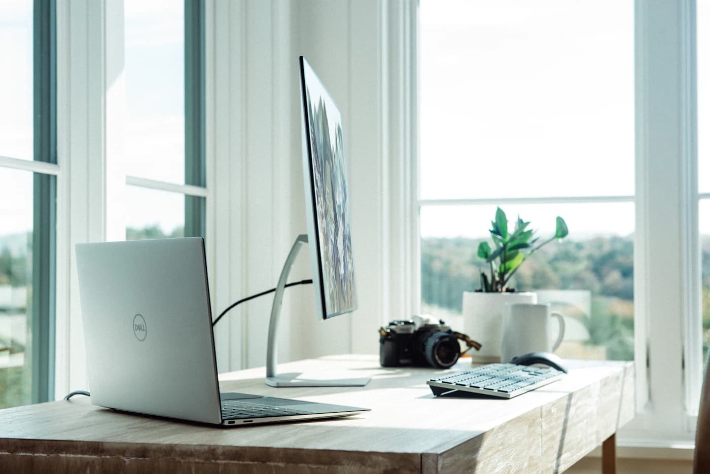 Business laptop and workstation peripherals on a desk